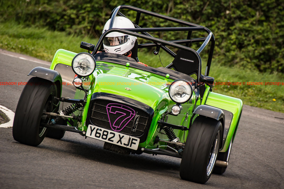 lime green caterham 7 rounding the fradley hairpin corner at curborough sprint track