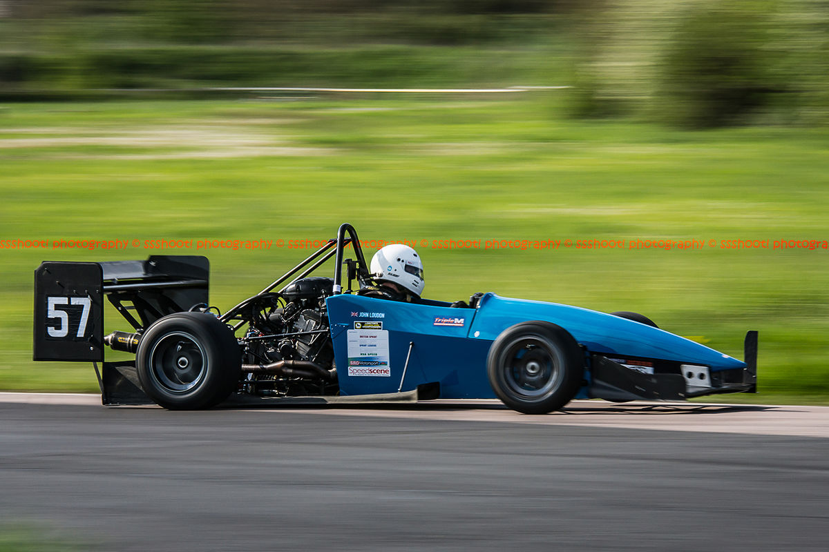 motorcycle engined race car shot at speed with panning photography