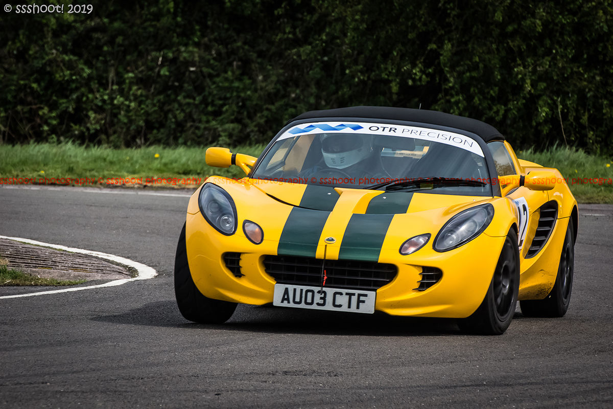 Green and yellow lotus elise negotiating curborough molehill corner