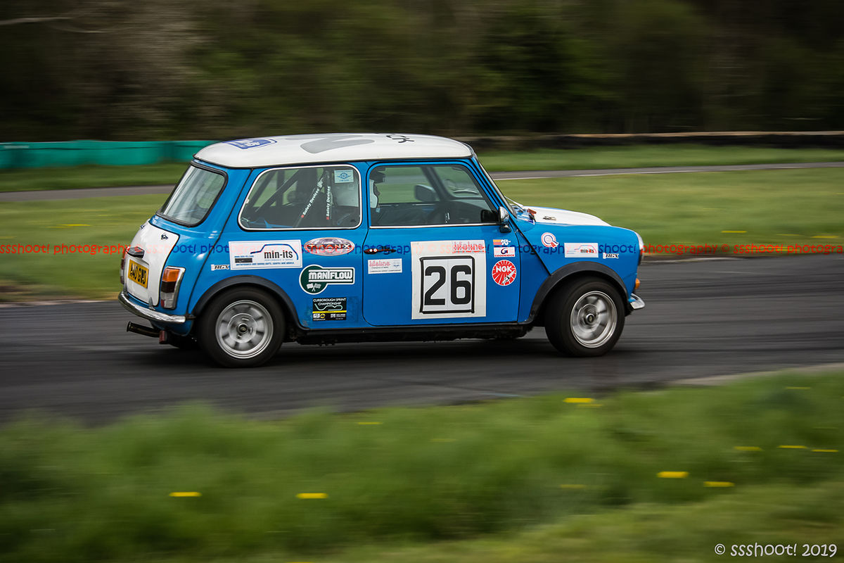 blue classic mini cooper s negotiating flagpole corner during curborough sprint championship 2019