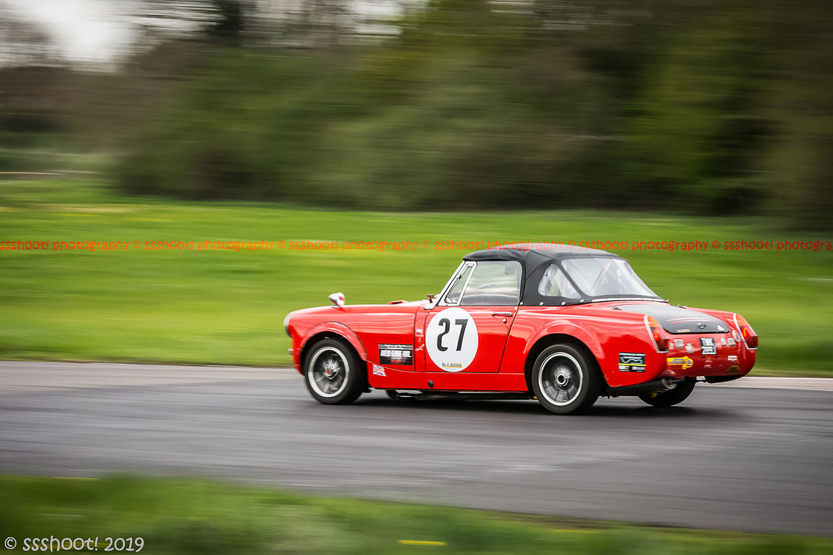 red mg midget at speed on curborough shenstone straight