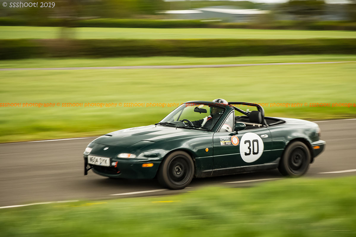 green mazda mx five at speed on curborough shenstone straight