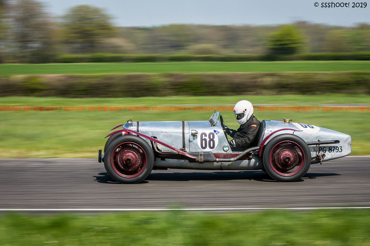 Aluminium vintage racing car at speed on curborough sprint course