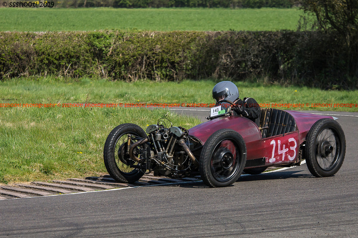 red jap engined vintage racing car at speed on curborough sprint course