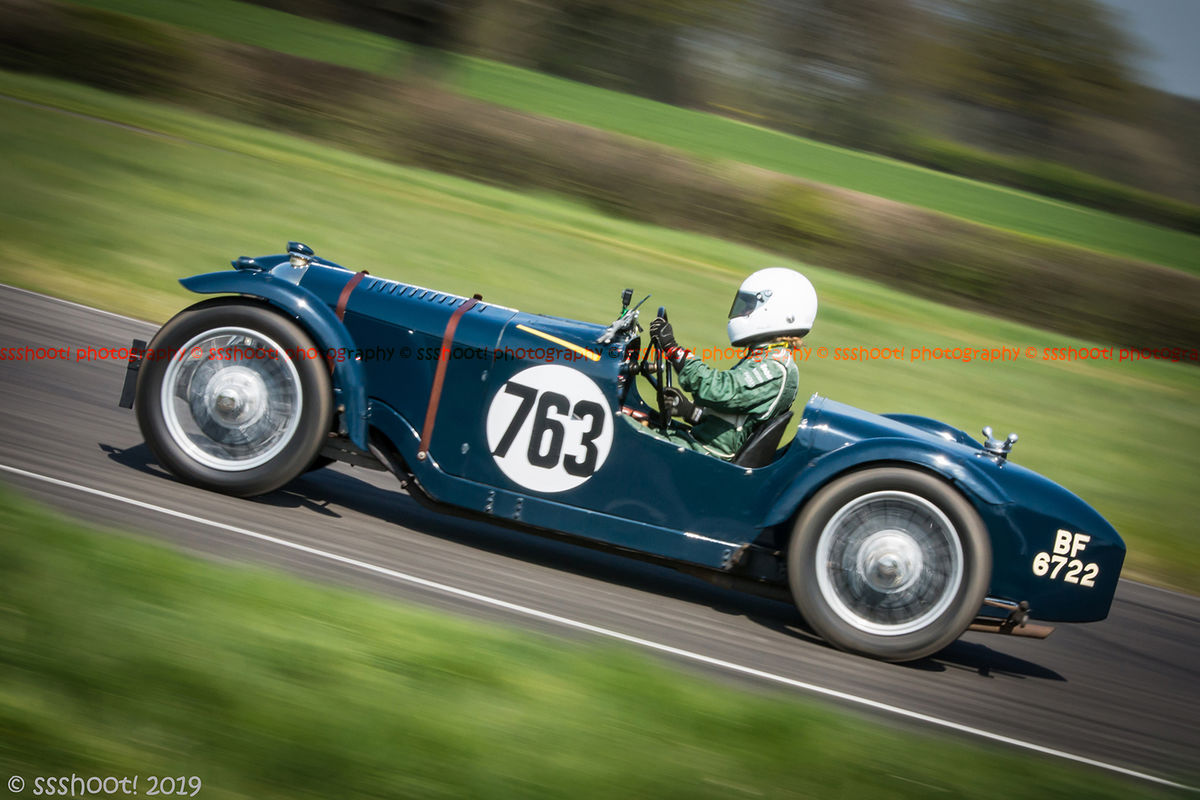 teal vintage racing car at speed on curborough sprint course