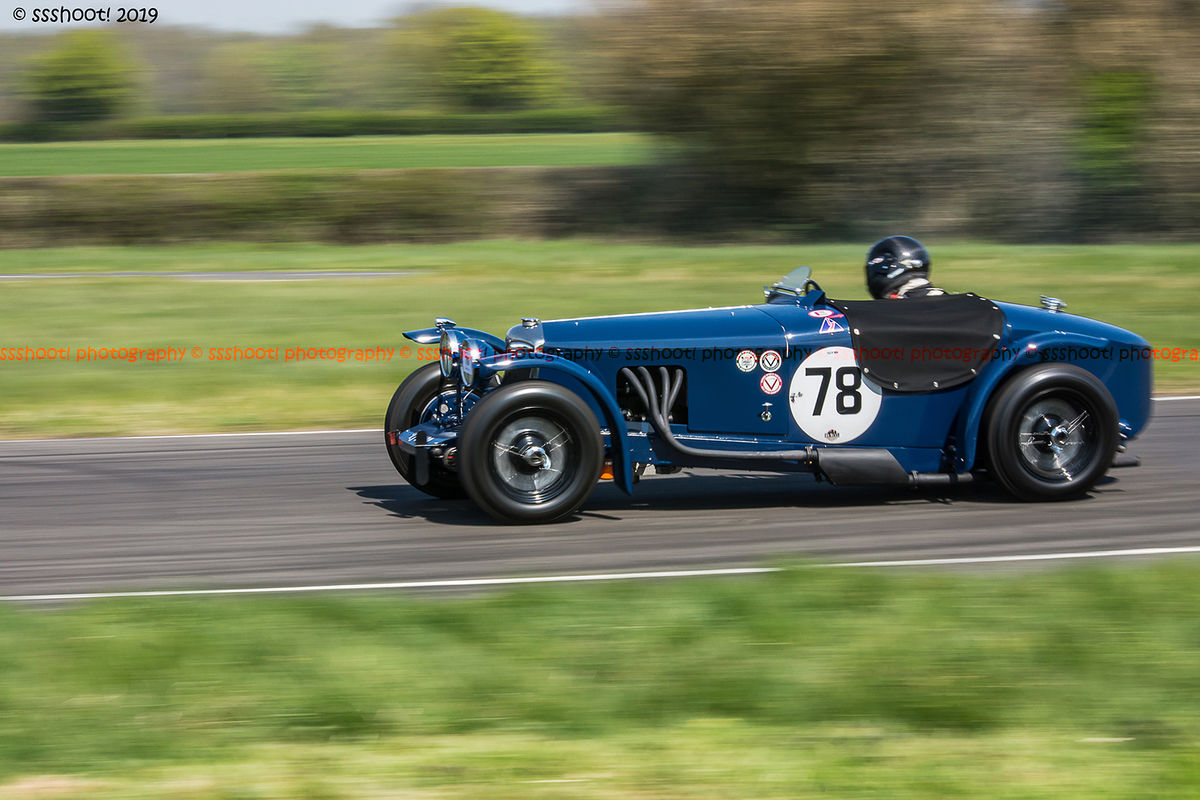 Blue vintage racing car at speed on curborough sprint course