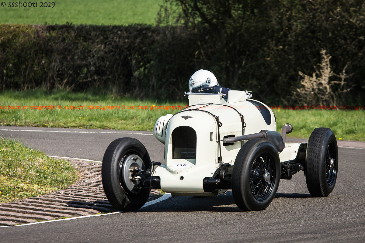 white vintage racing car at speed on curborough sprint course