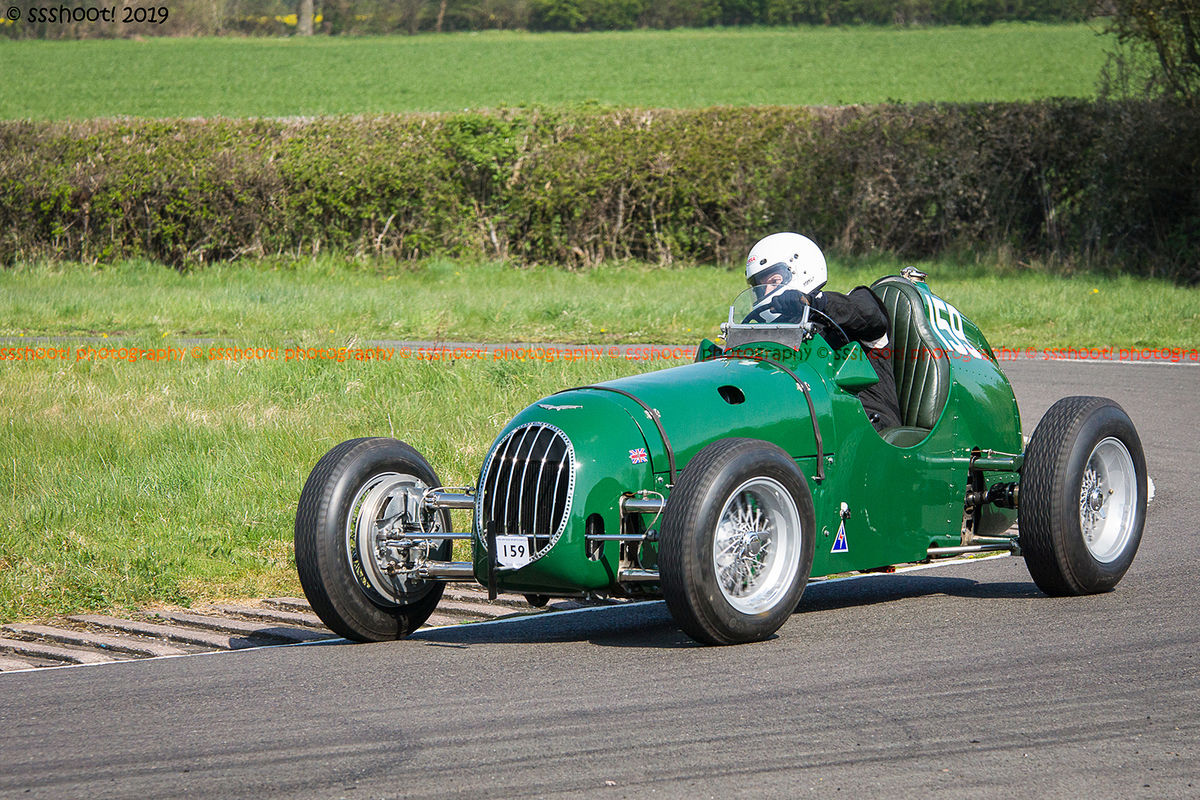 Green vintage racing car at speed on curborough sprint course