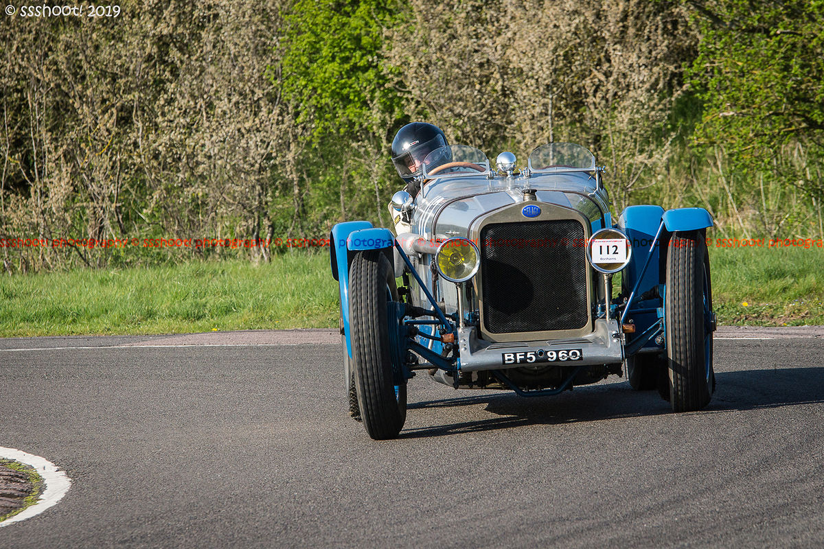 Blue vintage racing car at speed on curborough sprint course