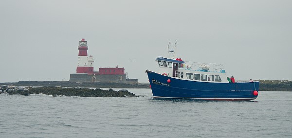 Pleasure Boat Passing Longstone Lighthouse