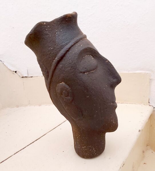 13. Greek style votive head
