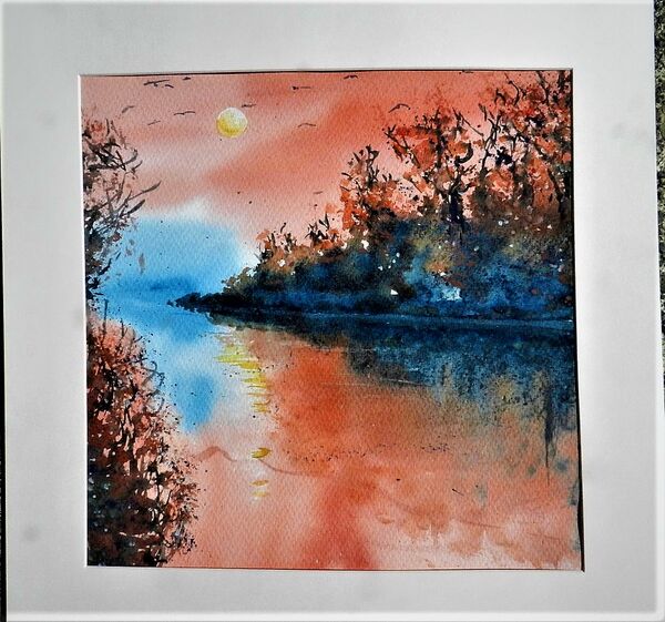 Quiet Cornish Creek with red sunset
