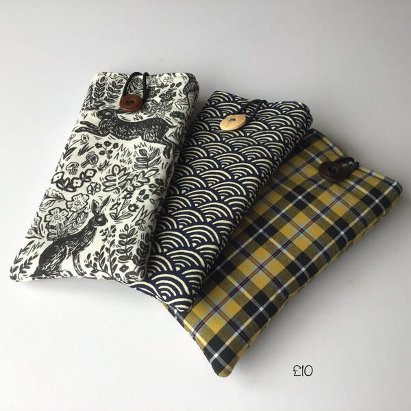 Button closure glasses cases