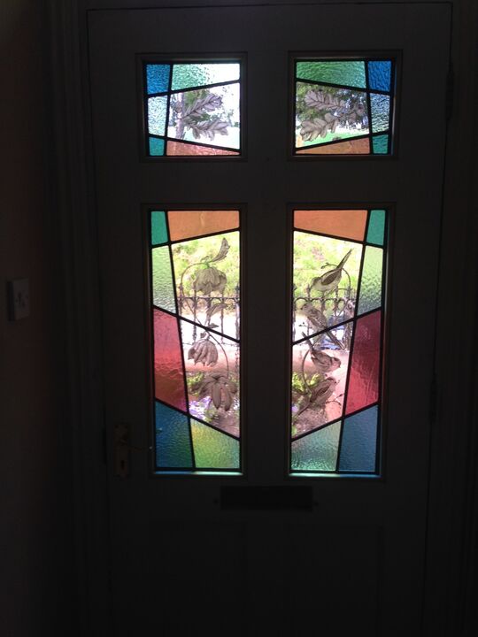 A letting light through a a once solid door.