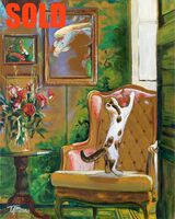 Kitten in a study with fish pictures