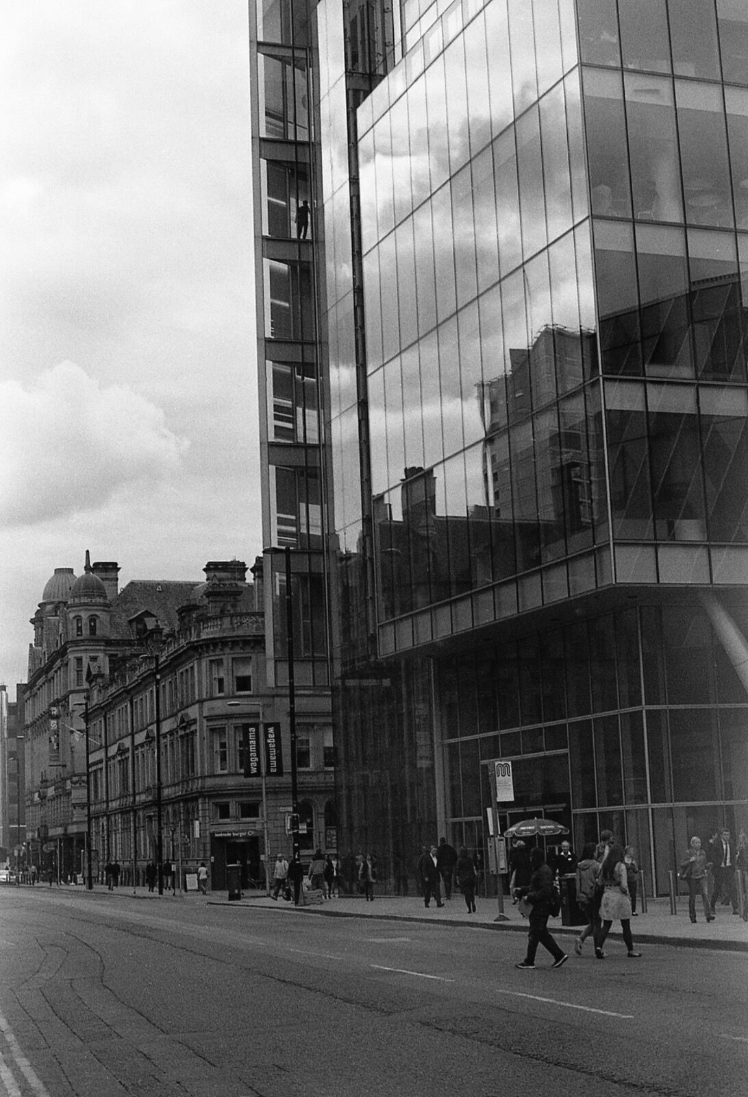 Man looks down on Deansgate...