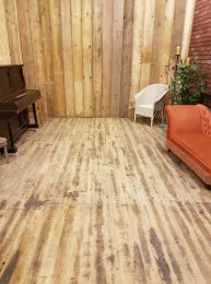 Sanded floor and wooden wall
