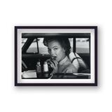 Marilyn Monroe Portrait in Car Eating Burger in Drive-Thru Framed Art Print from the Marilyn Monroe Collection