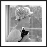 Model with cap and cat Framed Art Print by John French