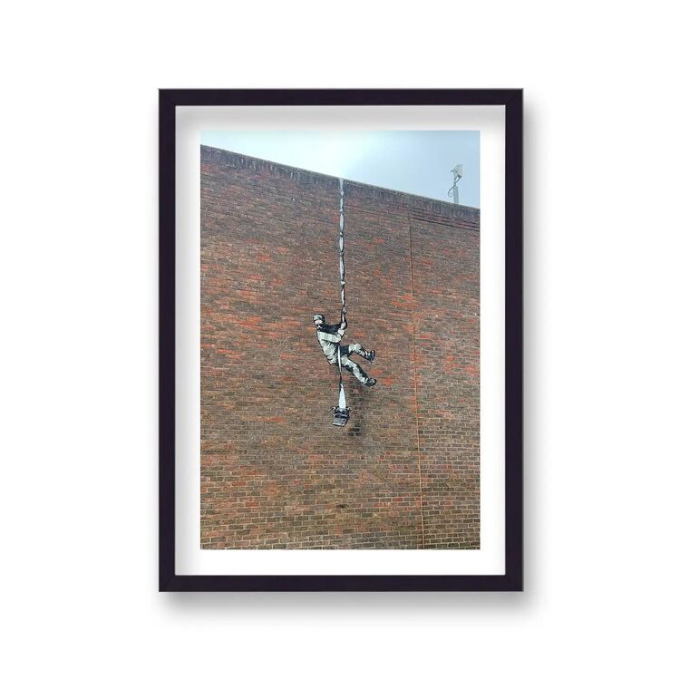 Reading Prison Framed Art Print by Banksy