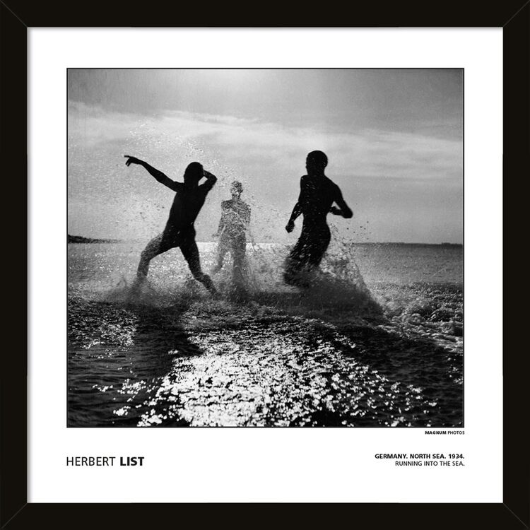 Herbert List - Germany. North Sea. 1934. Running into the sea. Framed Art Print by Magnum Photos