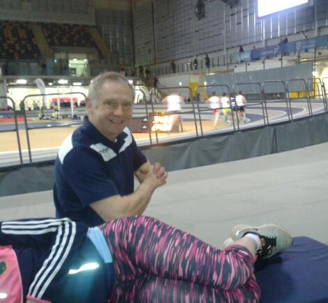 Sports Injury treatment - Chris treating an athlete at a Scottish Athletics indoor event