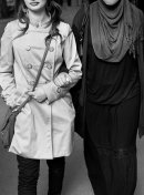 2 women walk along the street