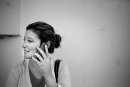 A young woman talks on the phone