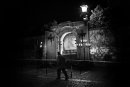 A man walks at night in front of the Easter street altar in Braga, Portugal.