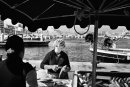 Fish market Woman cuts the fish with the scissors at the Fish market stall, Marseille, France