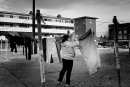 Woman hangs the laundry among the blocks, Dublin