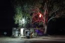 Makeshift petrol station undre the tree at night,Tunisia