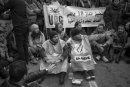 Young unemployed Tunisian men and women sit in a protest at the street of Tunis