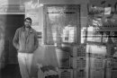 Tunisian young man stands in front of the building with hands in the pocket