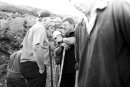 Croagh Patrick male pilgrims with the walking sticks chat during the pilgrimage