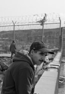 2 men by the border fence near Ceuta