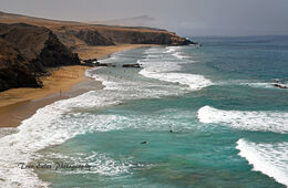 Surfers at Playa del Viejo Rey