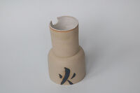 Vase with fire symbol