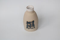 Vase with wind symbol