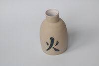 Vase with fire symbol