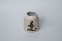 Vase with earth symbol