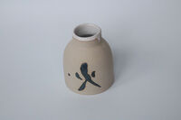 Vase with fire symbol