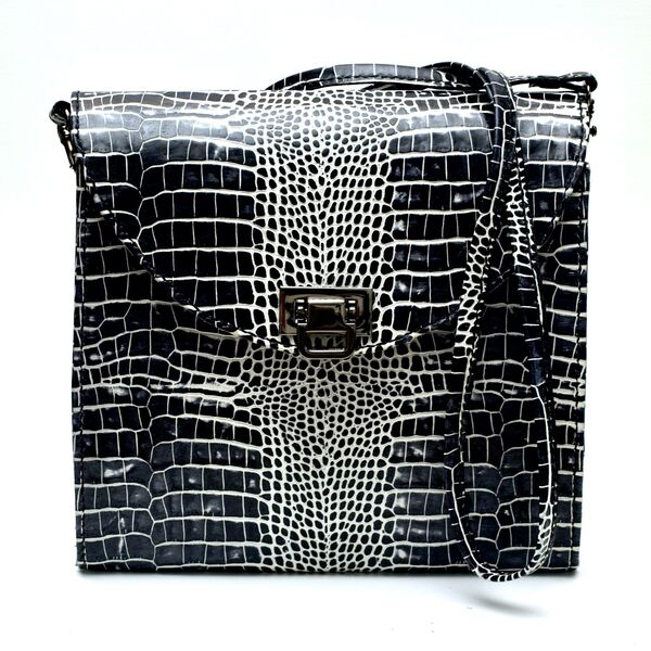 Black White Mock croc. Lined in pink suede. £95.00