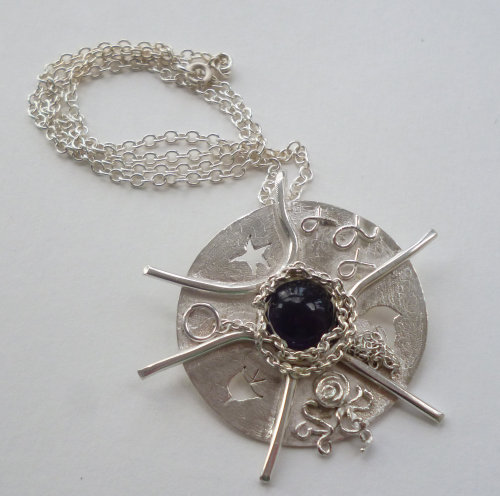 Amethyst and silver pendant