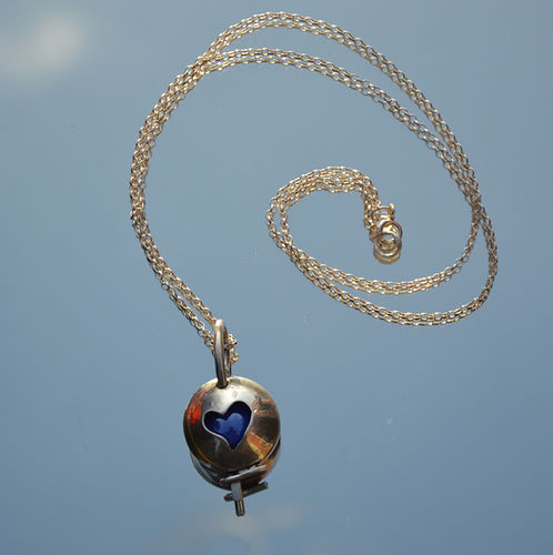Sterling silver heart marble locket.