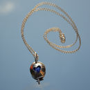 Sterling silver heart marble locket.