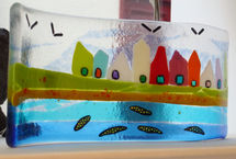 A curved panel showing beach huts