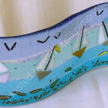 Curved panel showing yachts & dichroic fish