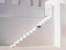 blue hat on white stairs