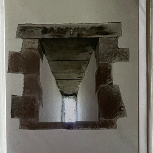 An old church window seen from below